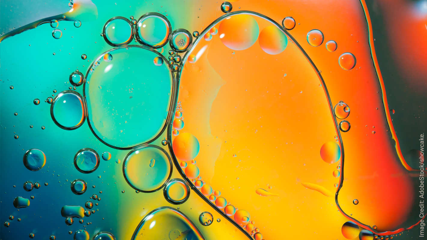 Cover image: Oil droplets suspended in water, forming round shapes.