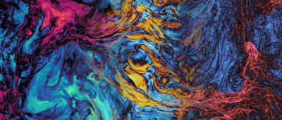 Image of an abstract, colorful pattern that resembles swirling fluids.